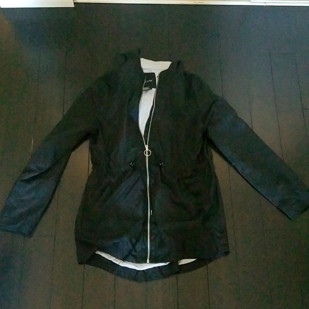 A black raincoat that is made from Me Jane